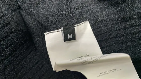 Black Fuzzy Knit Sweater With Script Graphic — warehouse QC photo 1