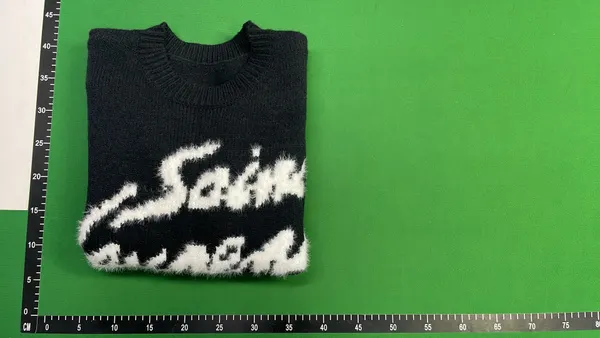 Black Fuzzy Knit Sweater With Script Graphic — warehouse QC photo 4