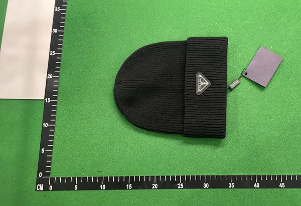 Ribbed Knit Cuffed Beanie With Triangle Badge — warehouse QC photo 4