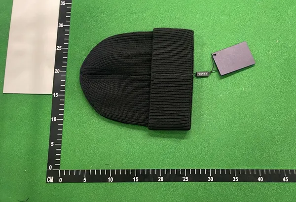 Ribbed Knit Cuffed Beanie With Triangle Badge — warehouse QC photo 5