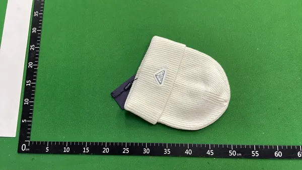 Ribbed Knit Cuffed Beanie With Triangle Badge (White) — warehouse QC photo 3