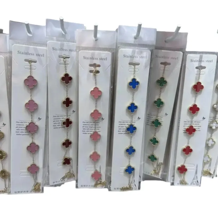 Gold Tone Chain Bracelet With Clover Charms — merchant catalogue photo