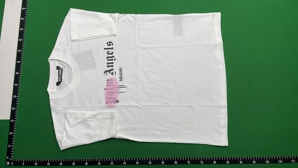 Black Tee With Spray Paint Chest Graphic — warehouse QC photo 2