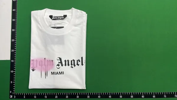 Black Tee With Spray Paint Chest Graphic — warehouse QC photo 4