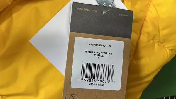 Black Baffle Quilted Puffer Jacket — warehouse QC photo 1