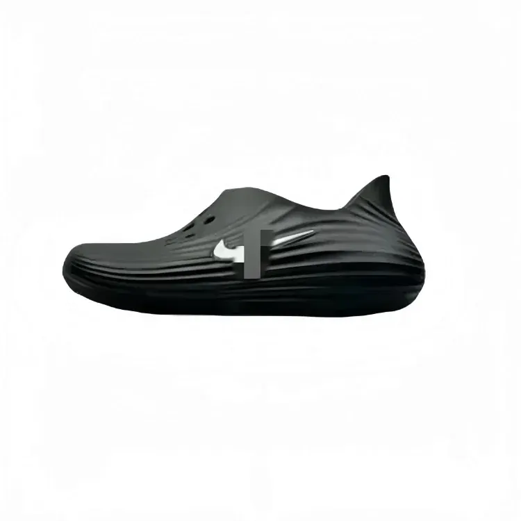 Black Molded Foam Clogs With Ridged Texture — merchant catalogue photo