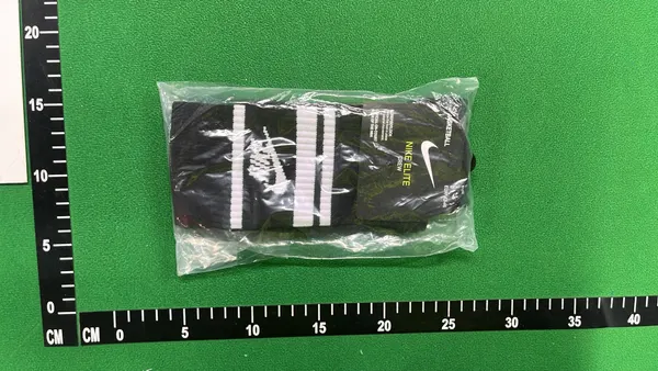 White Crew Socks With Orange And Black Stripes — warehouse QC photo 1