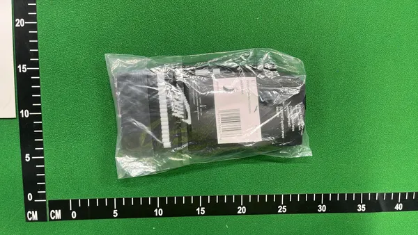 White Crew Socks With Orange And Black Stripes — warehouse QC photo 2