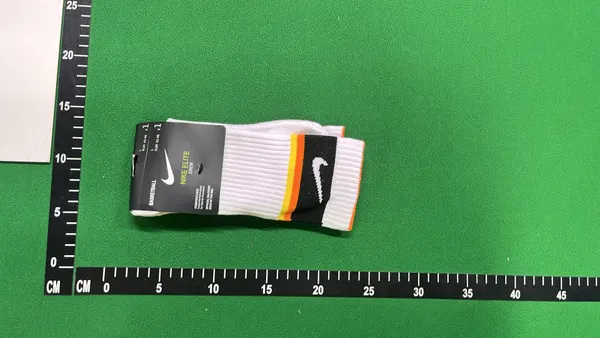 White Crew Socks With Orange And Black Stripes — warehouse QC photo 4