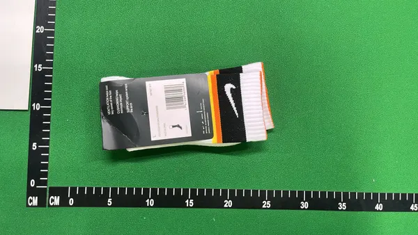 White Crew Socks With Orange And Black Stripes — warehouse QC photo 5