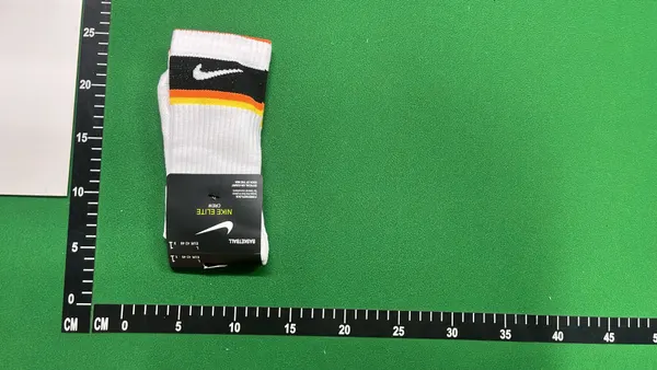 White Crew Socks With Orange And Black Stripes — warehouse QC photo 6
