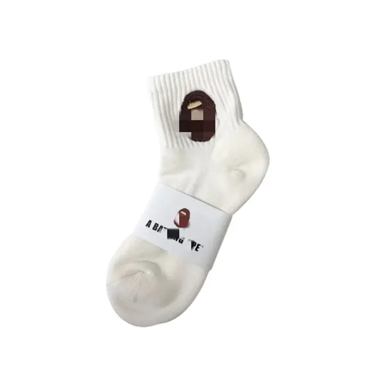 White Ribbed Crew Socks With Embroidered Logo — merchant catalogue photo