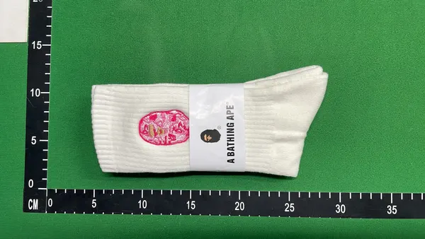 White Ribbed Crew Socks With Embroidered Logo — warehouse QC photo 1