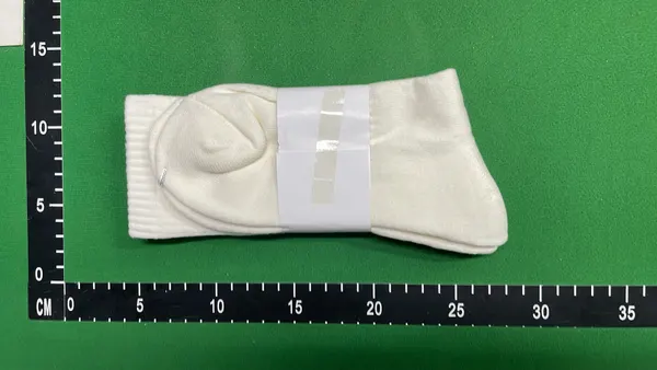 White Ribbed Crew Socks With Embroidered Logo — warehouse QC photo 2