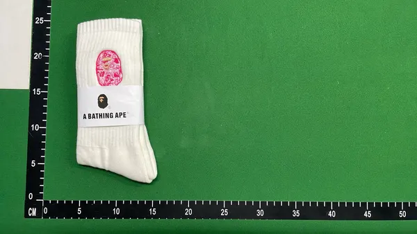 White Ribbed Crew Socks With Embroidered Logo — warehouse QC photo 3