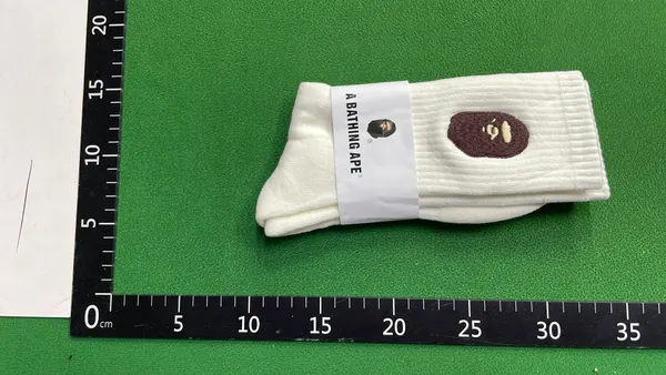 White Ribbed Crew Socks With Embroidered Logo — warehouse QC photo 4