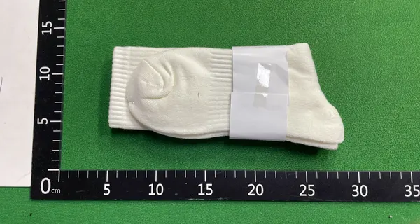 White Ribbed Crew Socks With Embroidered Logo — warehouse QC photo 5