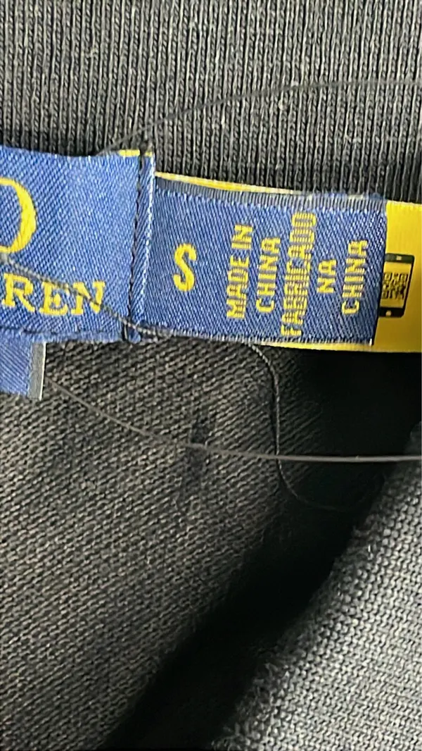 Black Polo Shirt With City Name Print — warehouse QC photo 1