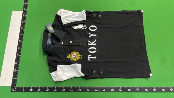 Black Polo Shirt With City Name Print — warehouse QC photo 2