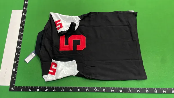 Black Polo Shirt With City Name Print — warehouse QC photo 3