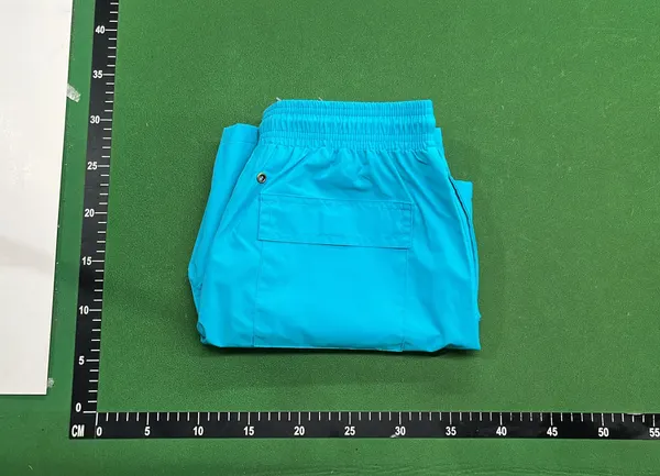 Light Blue Drawstring Beach Shorts — warehouse QC photo 4