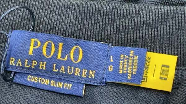 Black Pique Knit Polo Shirt — warehouse QC photo 5