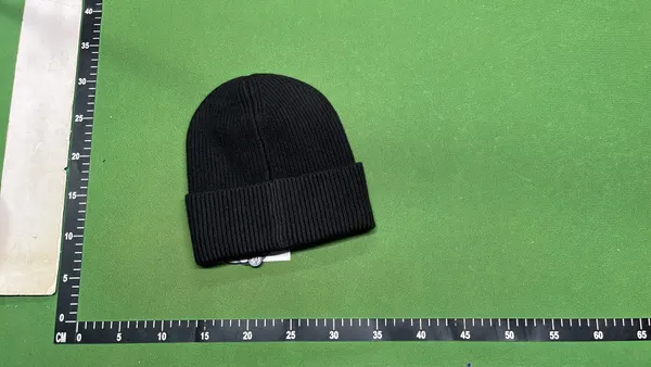 Ribbed Knit Beanie With Oval Patch Badge — warehouse QC photo 2