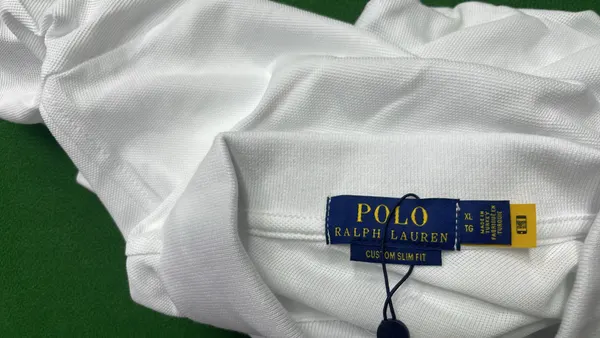 Black Polo Shirt With Number Sleeve Print — warehouse QC photo 1
