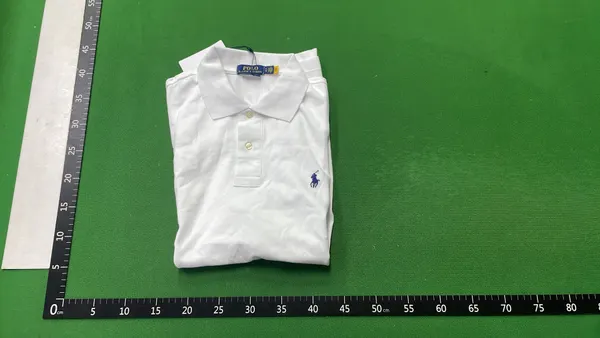 Black Polo Shirt With Number Sleeve Print — warehouse QC photo 4