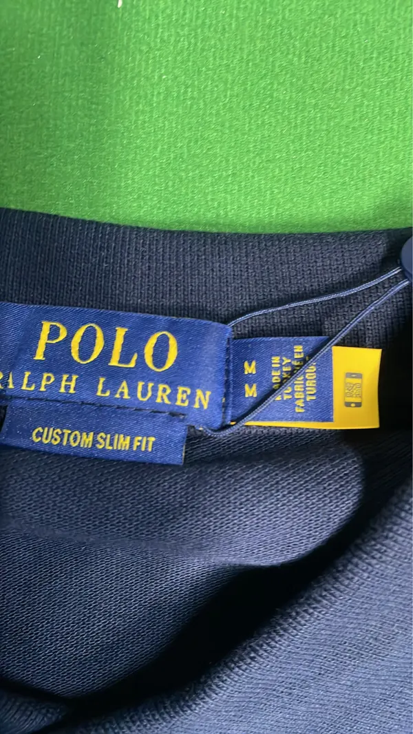 Black Polo Shirt With Number Sleeve Print — warehouse QC photo 5