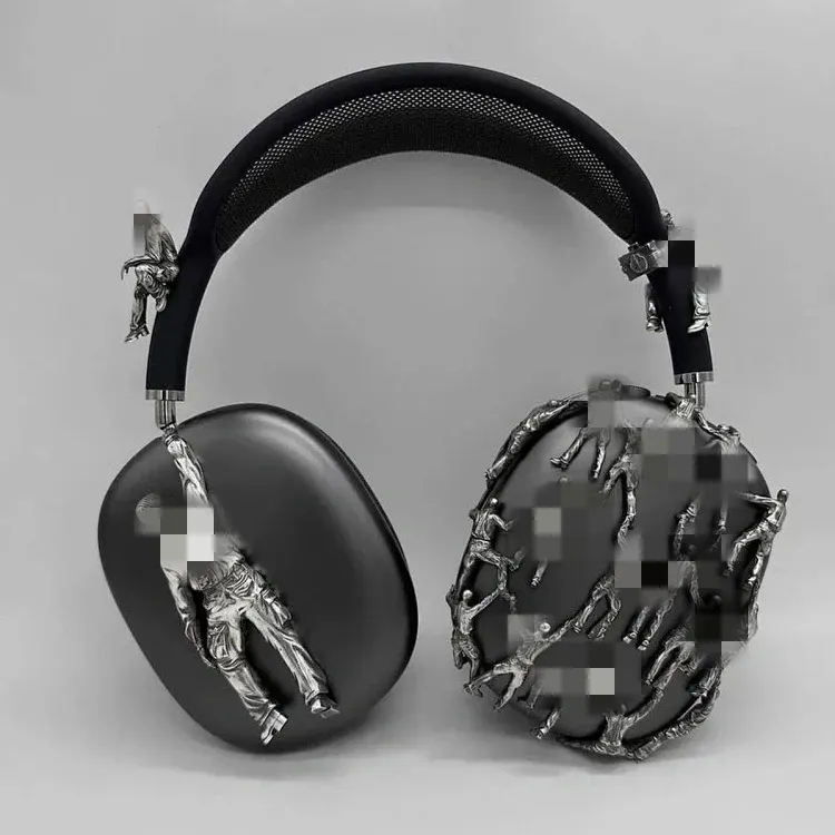 Black Headphones With Silver Figurine Sculptures — merchant catalogue photo