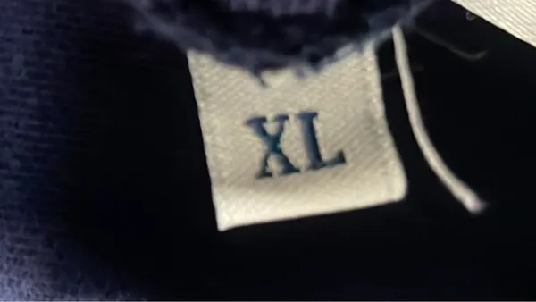 Black Crewneck Sweatshirt With Chest Patch — warehouse QC photo 1
