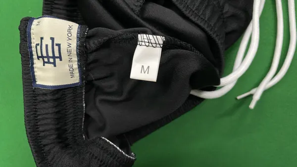 Mesh Basketball Shorts With Embroidered Leg Logo (Black) — warehouse QC photo 5
