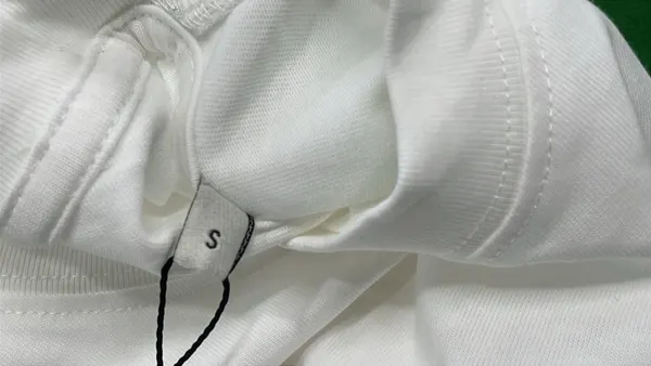 White Boxy T-Shirt With Red Heart Emblem — warehouse QC photo 1