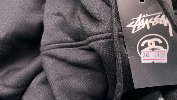 Black Hoodie With White Script Chest Print — warehouse QC photo 5