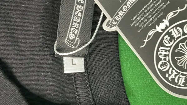 Black Oversized Tee With Tonal Cross Print — warehouse QC photo 1