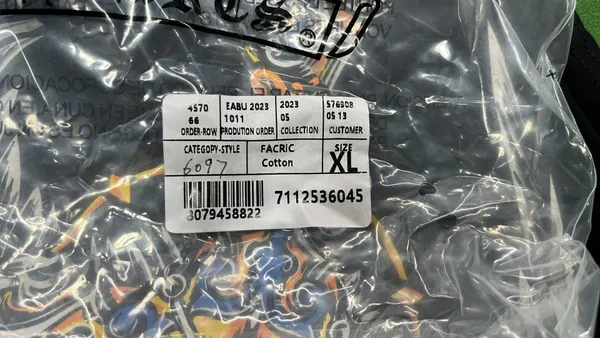 Black Oversized Tee With Tonal Cross Print — warehouse QC photo 5