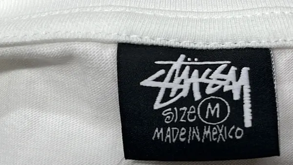 White Tee With Script Logo City Print — warehouse QC photo 1