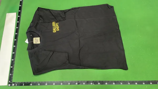 Black Oversized T-Shirt With White Text Print — warehouse QC photo 2