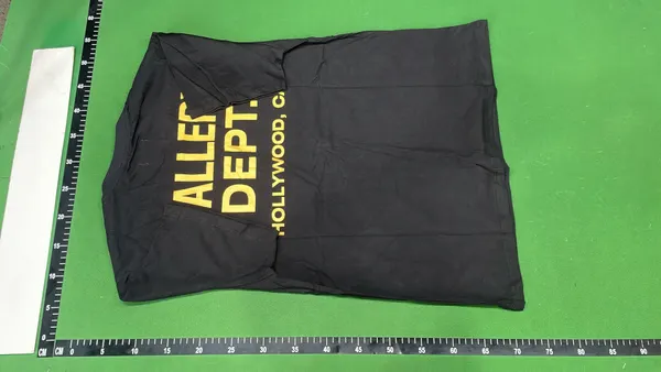 Black Oversized T-Shirt With White Text Print — warehouse QC photo 3