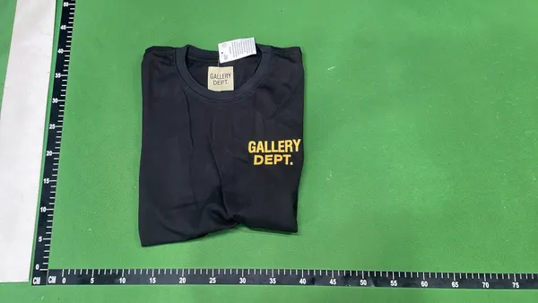 Black Oversized T-Shirt With White Text Print — warehouse QC photo 4