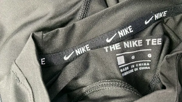 Black Fitted Compression Tee With Chest Emblem — warehouse QC photo 1