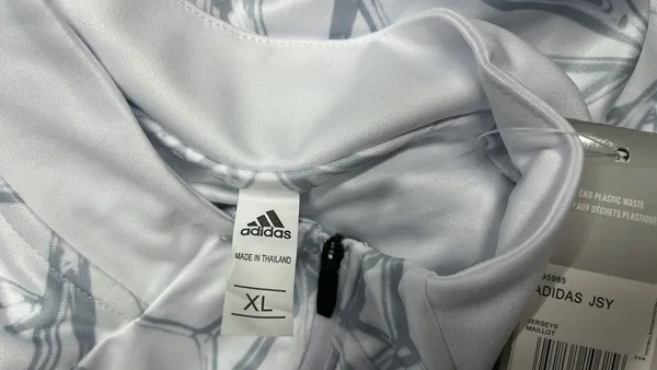 White Geometric Print Quarter Zip Training Top — warehouse QC photo 1