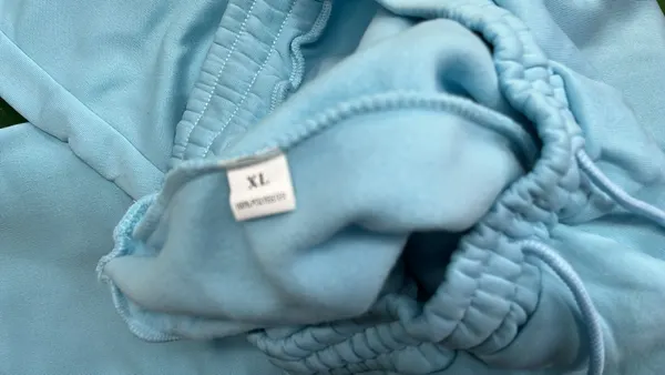 Grey Raglan Hoodie With White Hood Lining — warehouse QC photo 1