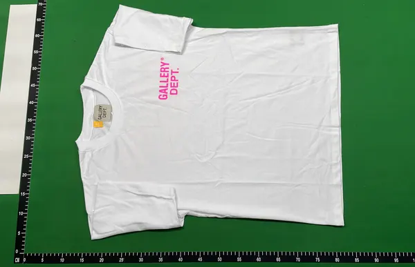 Black Tee With Block Letter Back Print — warehouse QC photo 2