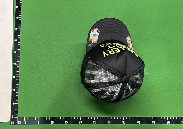 Black Mesh Trucker Cap With Painted Floral Detail — warehouse QC photo 2