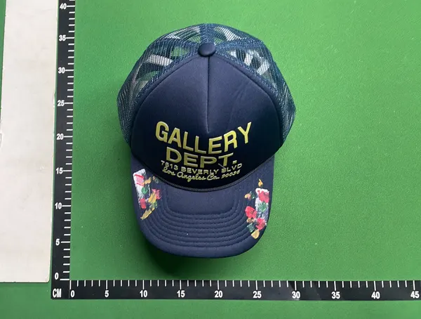 Black Mesh Trucker Cap With Painted Floral Detail — warehouse QC photo 4