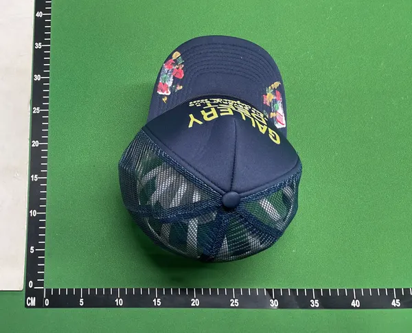 Black Mesh Trucker Cap With Painted Floral Detail — warehouse QC photo 5
