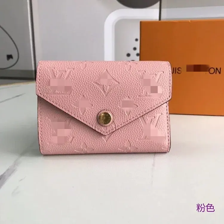 Pink Embossed Monogram Compact Flap Wallet — merchant catalogue photo