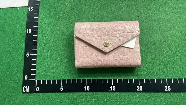 Pink Embossed Monogram Compact Flap Wallet — warehouse QC photo 1